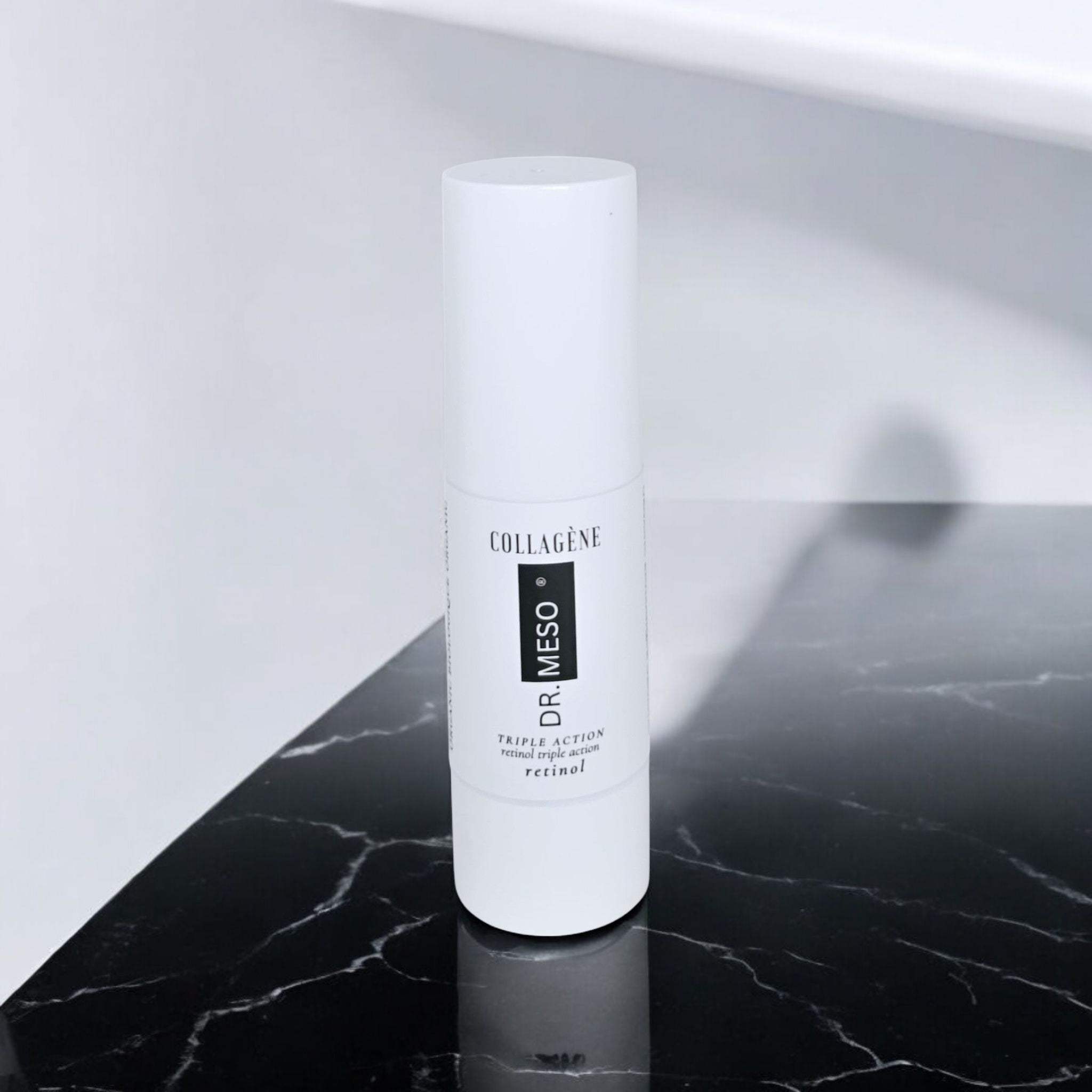 Serum bottle labeled Collagene Retinol with dropper on white background.